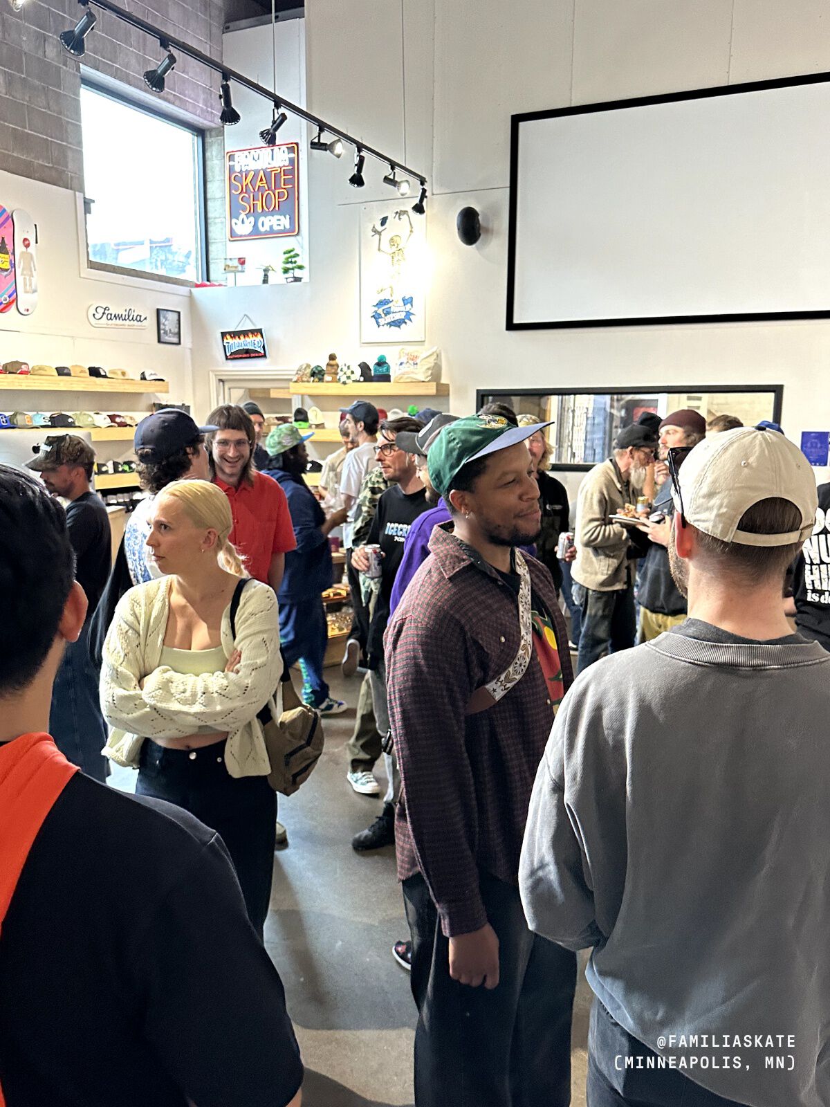 Photo of people standing inside the skate shop.