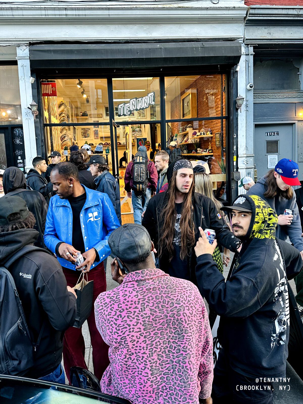 Photo of a people standing outside of a skate shop.